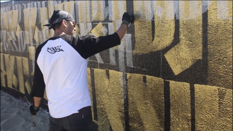 Venice Beach mural in black, gold and silver by Zak Perez