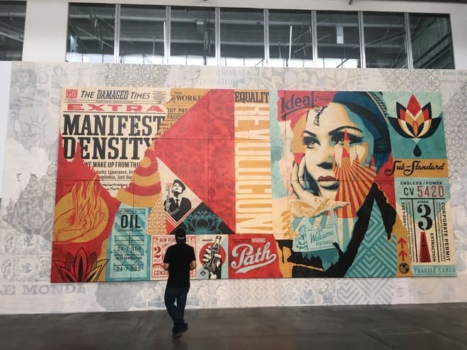 Paste up graffiti mural by Shepherd Fairey