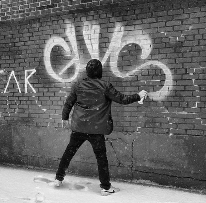 Graffiti tagging on a brick wall
