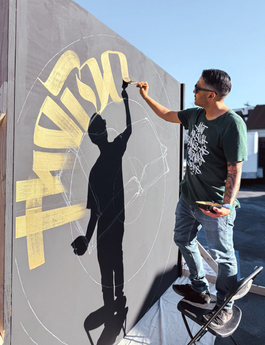 Zak Perez painting a live mural in LA Art District